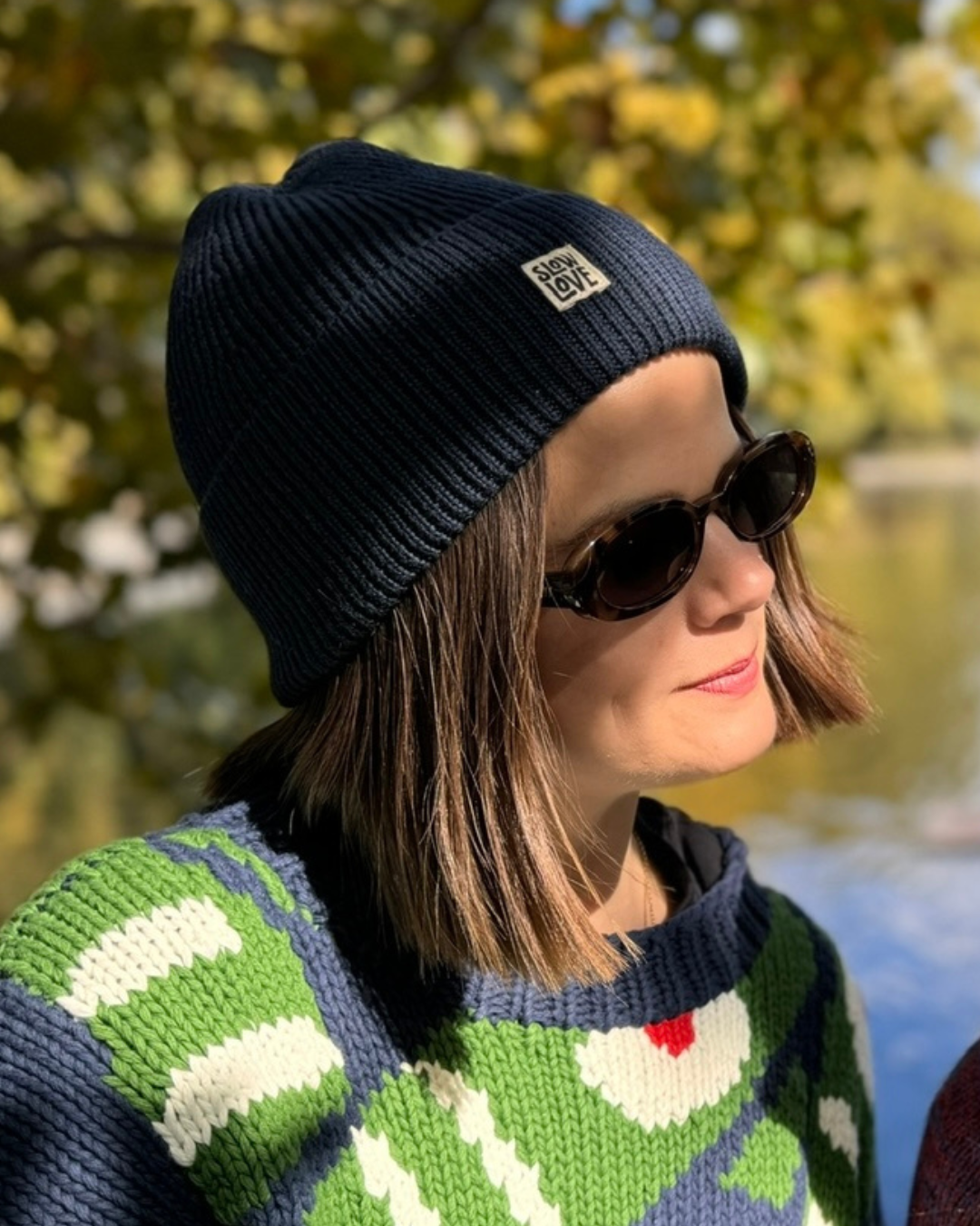 Women's knitted staple merino wool beanie in navy by Slow Love.