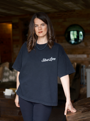 Slow Love Studio faded black oversized boxy t-shirt made from heavyweight organic cotton, front view.