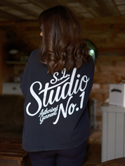 Back view of Slow Love Studio oversized faded black organic cotton t-shirt.