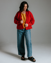 Red cotton knit cardigan styled as a lightweight layering piece, relaxed fit