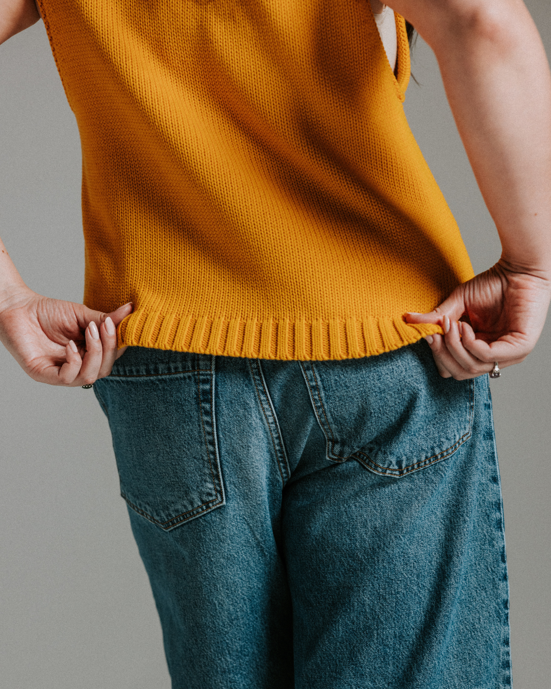 Close-up of yellow cotton knit tank top showing soft knit texture