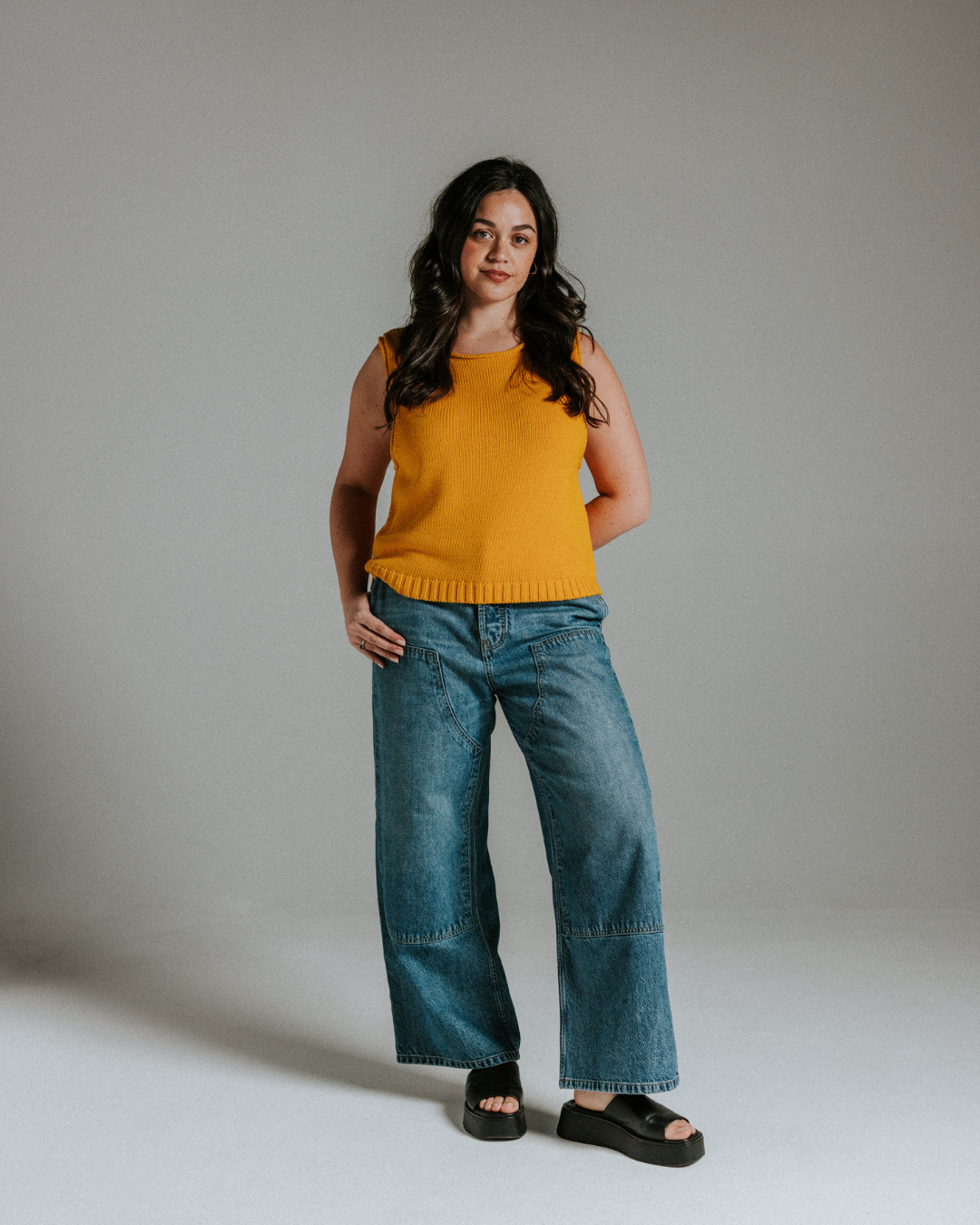 Close-up of yellow cotton knit tank top showing soft knit texture