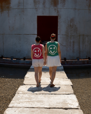 Boxy fit tank top with smiley face design and dropped armholes in 100% cotton