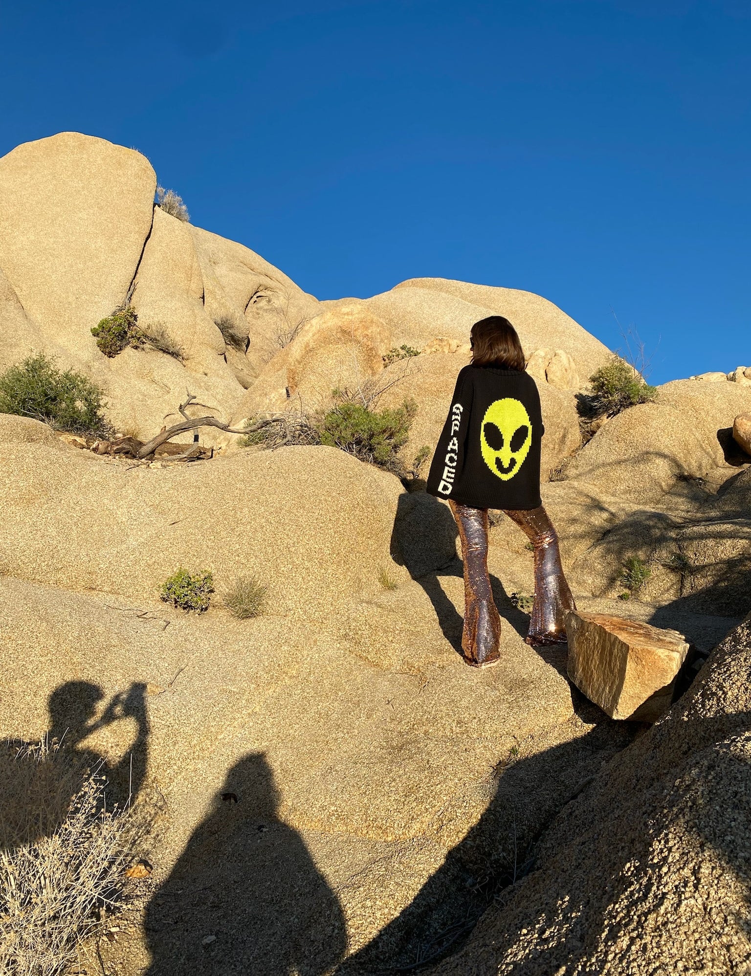 Lifestyle image of model wearing Spaced Out hand knit jumper back view