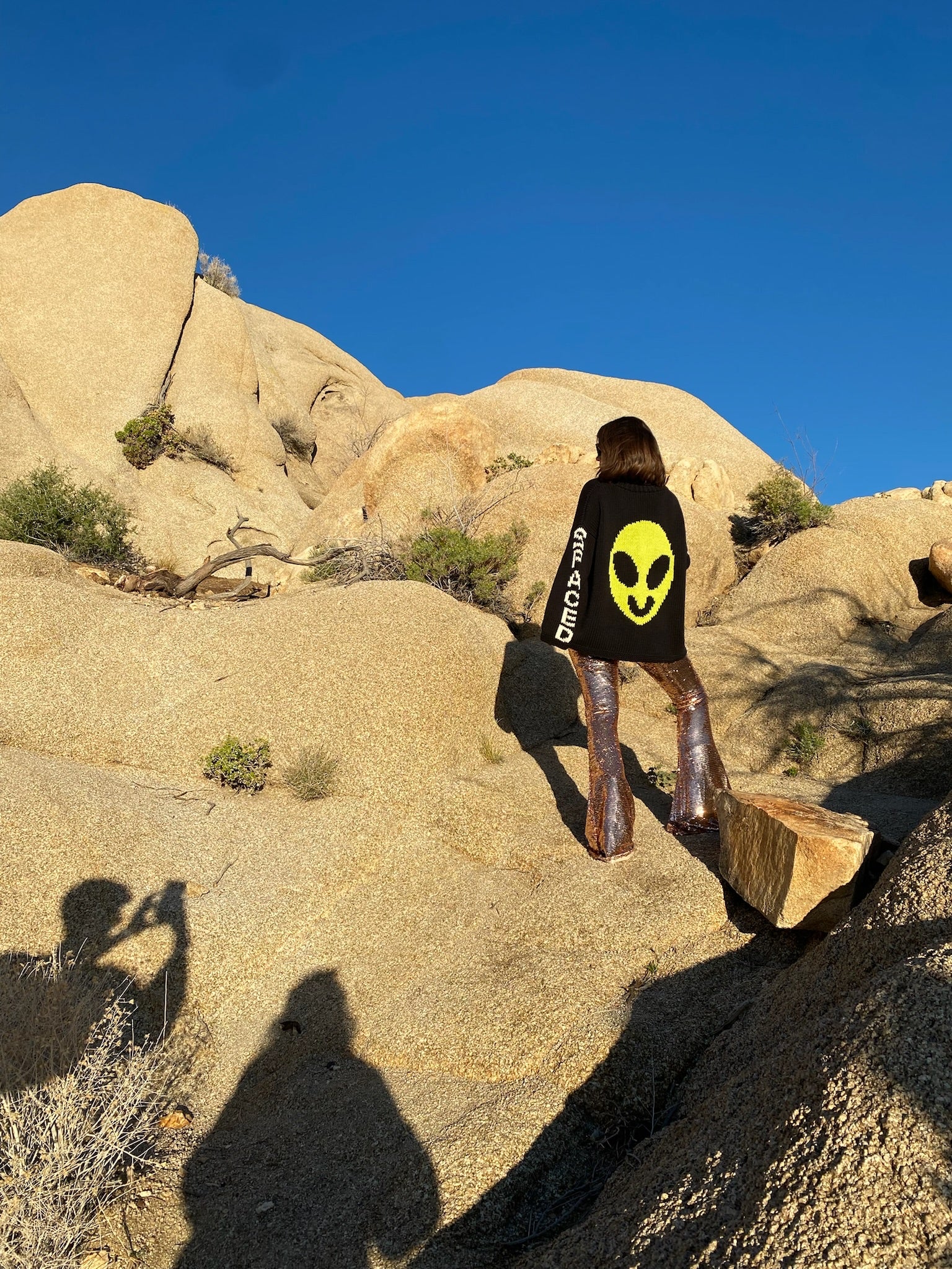 Lifestyle image of model wearing Spaced Out hand knit jumper back view