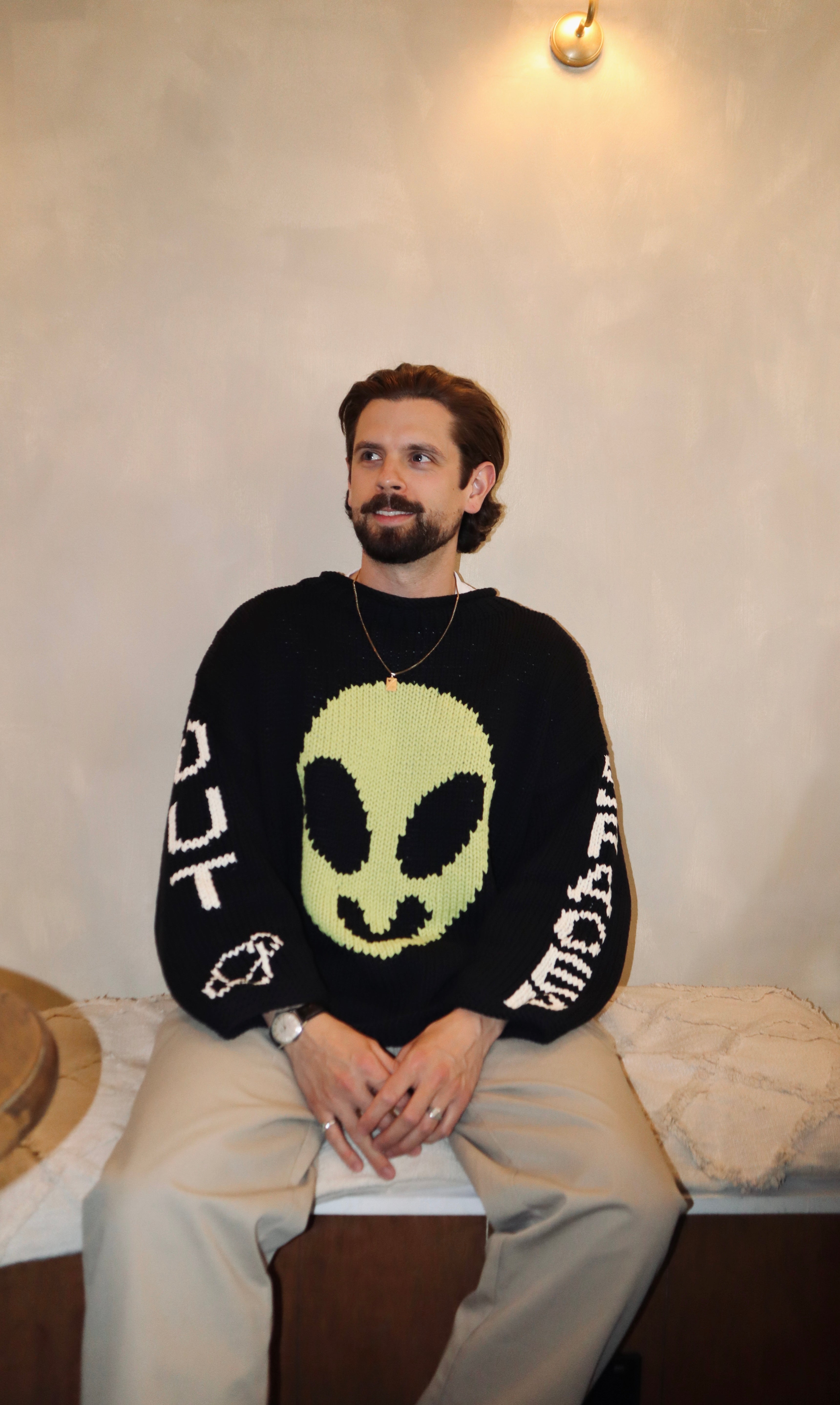 Detail of Spaced Out motif on hand knit cotton jumper