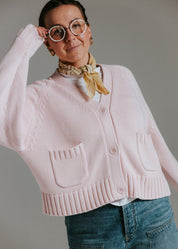 Close-up of front pocket detail on The Staple Cardigan in mallow