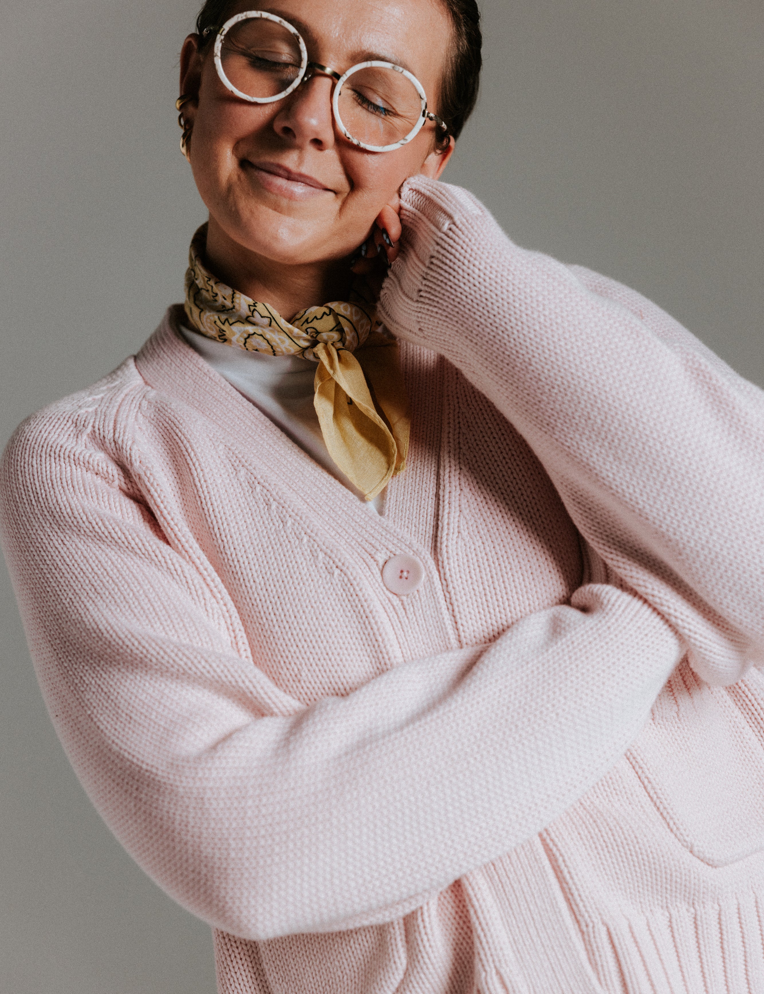 Raglan sleeve detail on The Staple Cardigan in mallow pink cotton knit