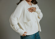 Close-up of premium cotton knit texture on The Staple Cardigan in panna cotta