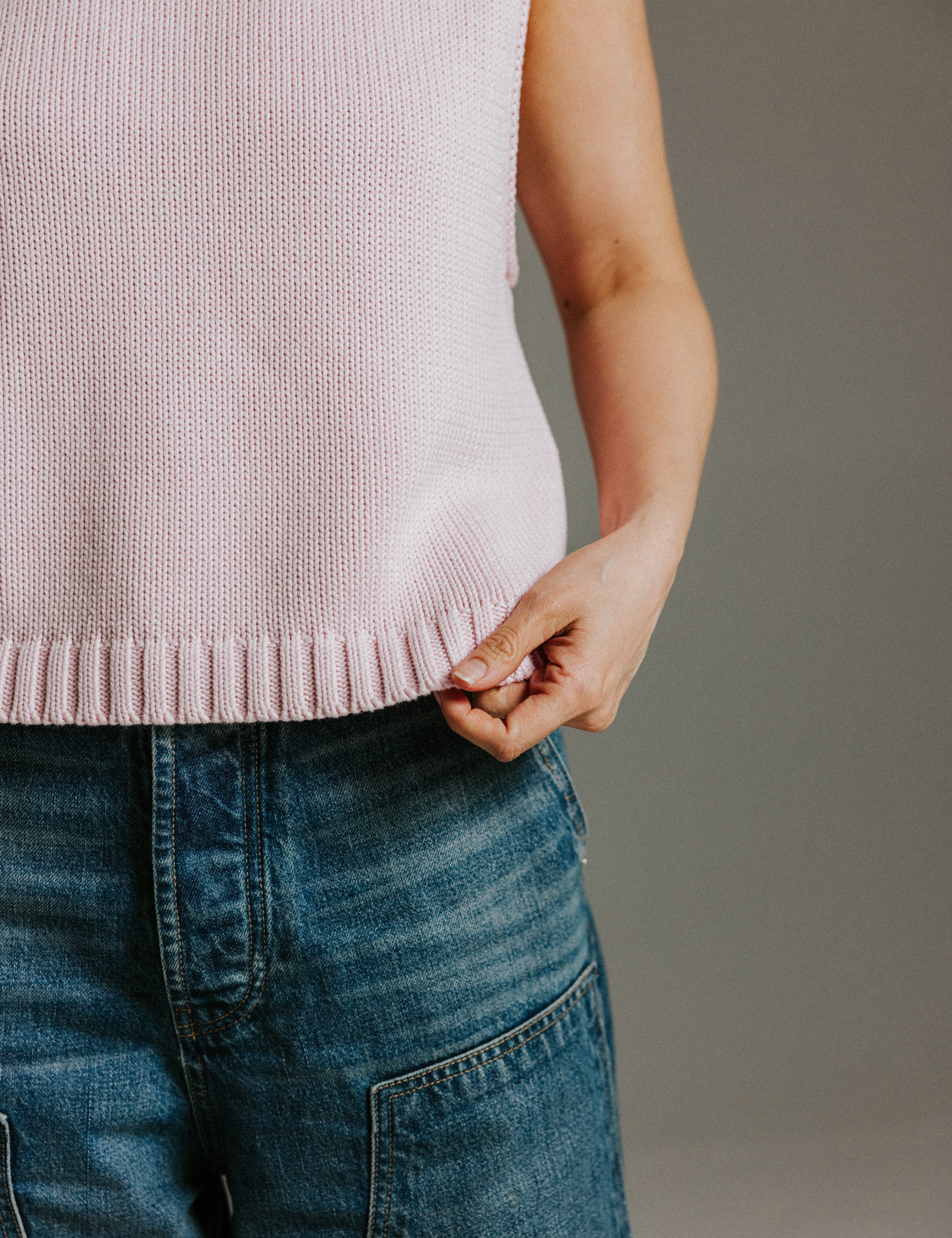 Ribbed hem and side split detail on The Staple Tank in mallow pink cotton knit