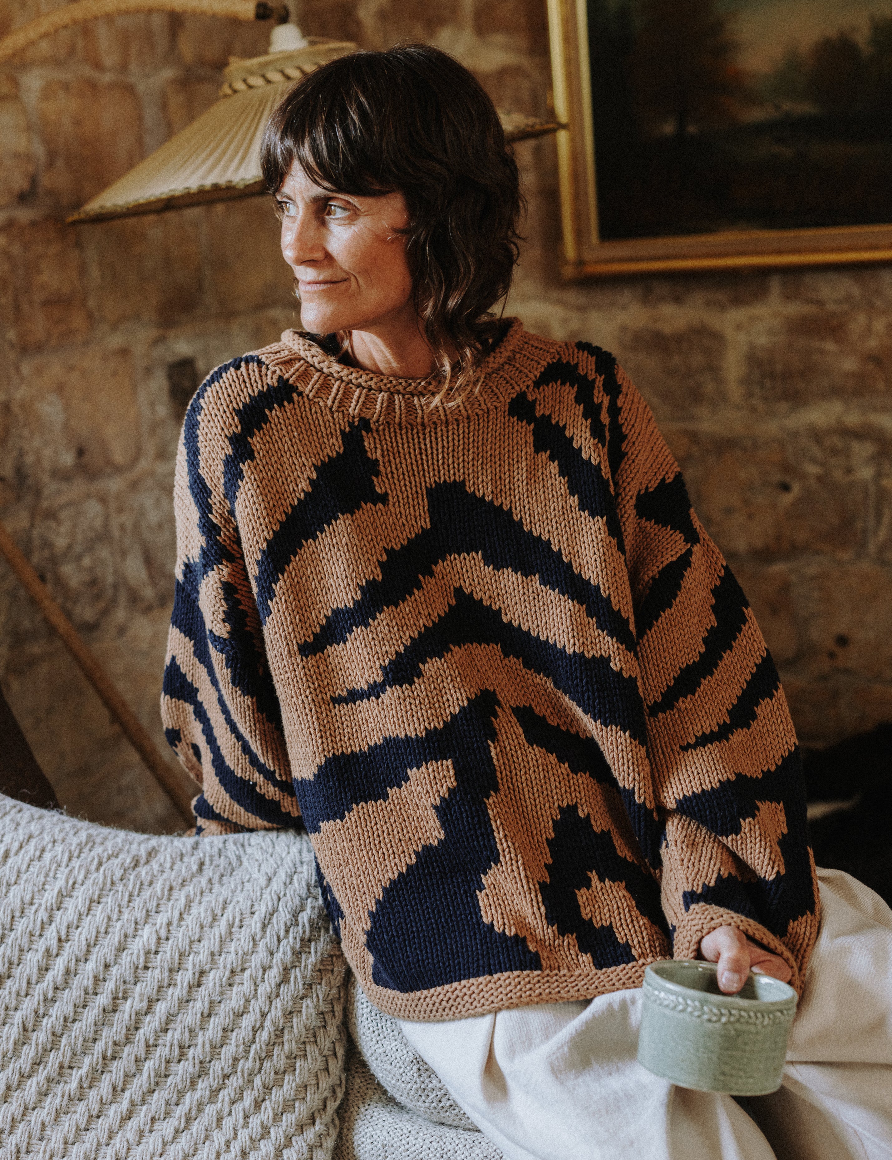 Close-up of the two-colour intarsia tiger pattern on the Tiger Hand Knit Jumper