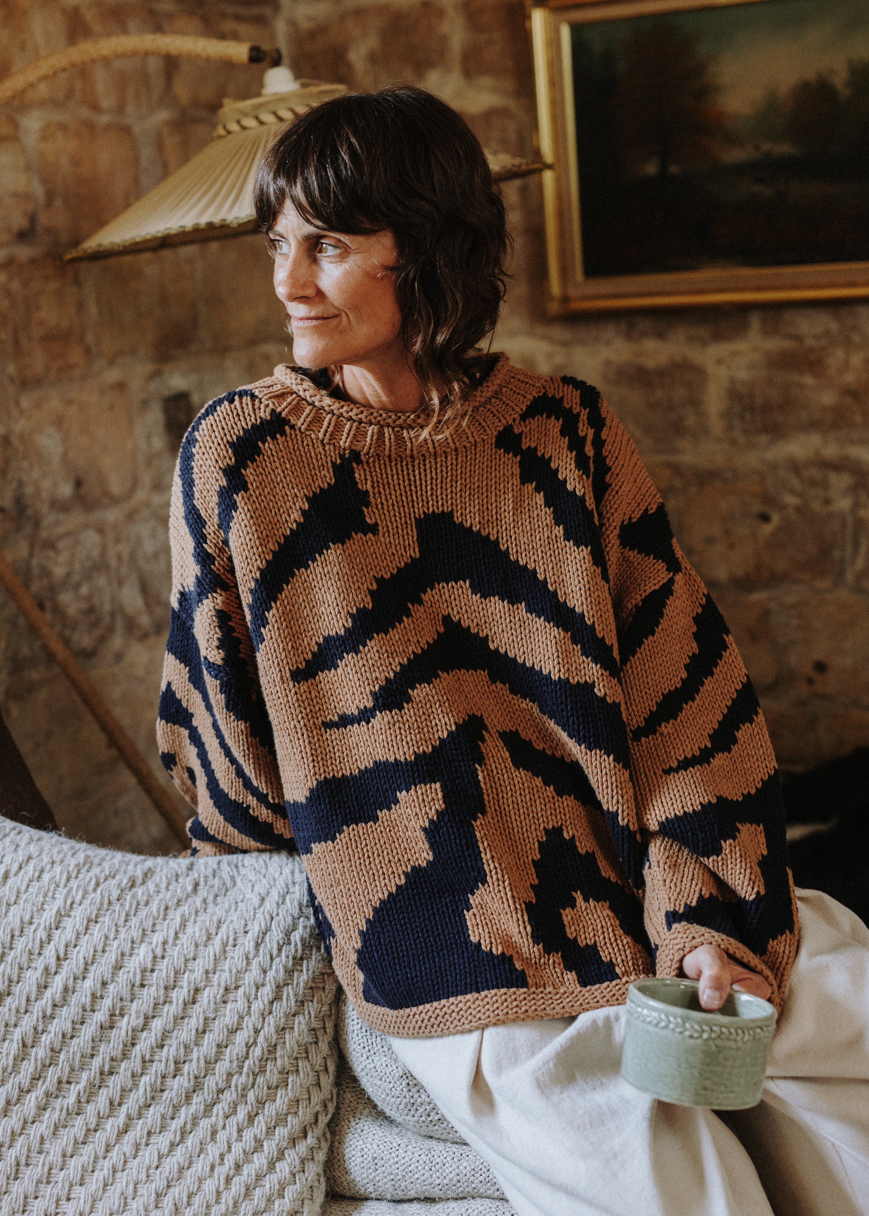 Close-up of the two-colour intarsia tiger pattern on the Tiger Hand Knit Jumper