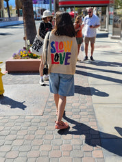 Styled lifestyle image of Tutti Frutti oversized multicoloured hand knit jumper
