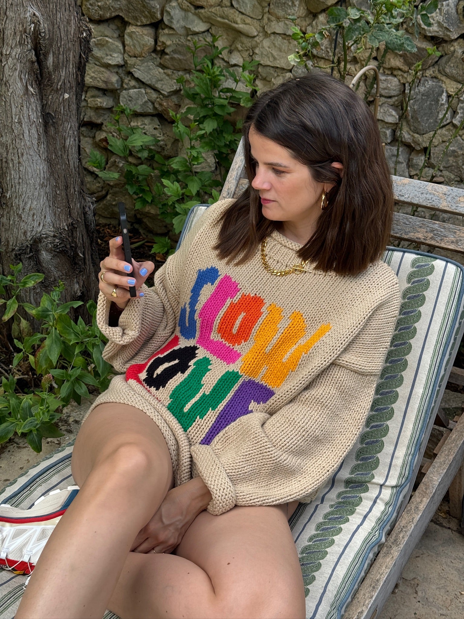 Side view of model wearing Tutti Frutti multicoloured cotton jumper sleeve detail