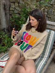 Side view of model wearing Tutti Frutti multicoloured cotton jumper sleeve detail