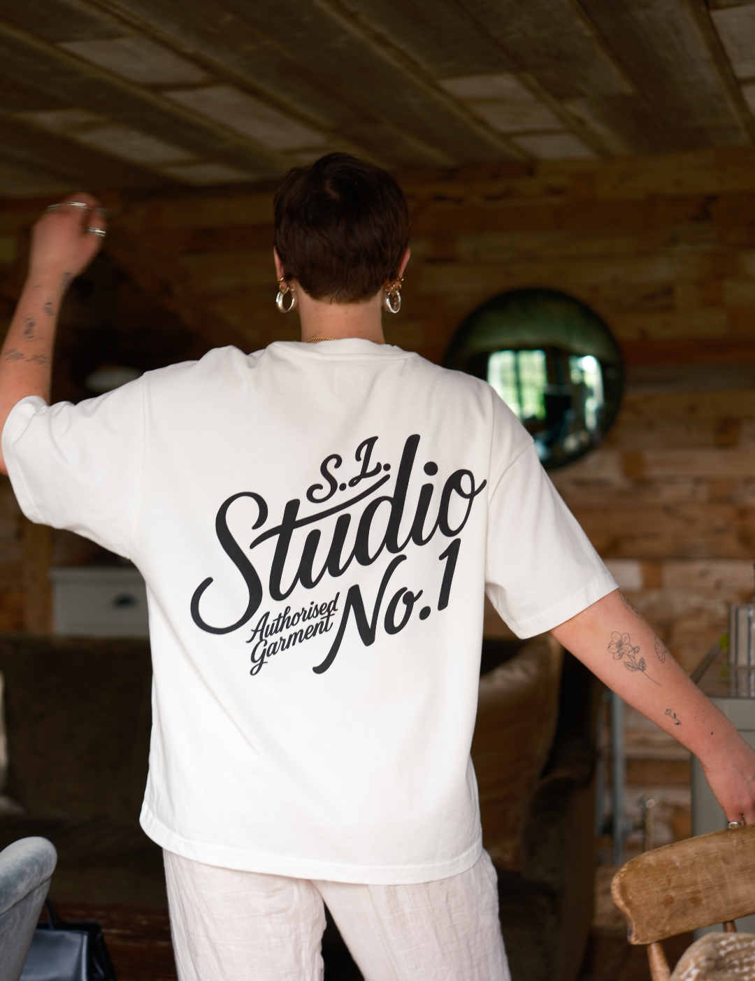 Lifestyle shot of heavyweight 250gsm organic cotton fabric used in the White Slow Love Studio t-shirt.