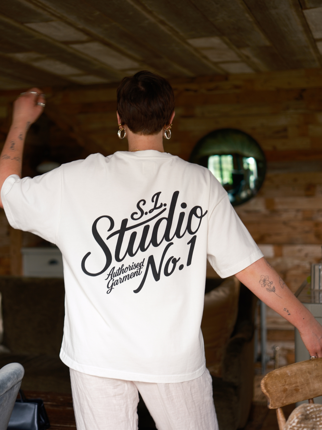 Lifestyle shot of heavyweight 250gsm organic cotton fabric used in the White Slow Love Studio t-shirt.