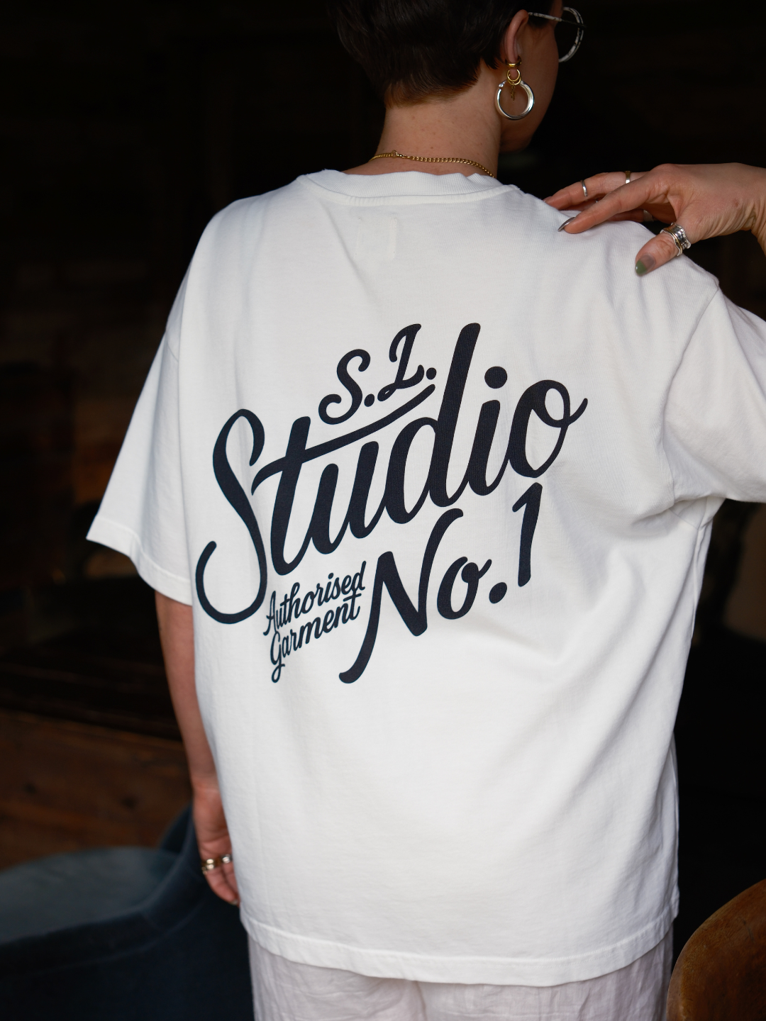 Luxury white organic cotton oversized t-shirt by Slow Love Knitwear styled as a versatile everyday wardrobe staple.