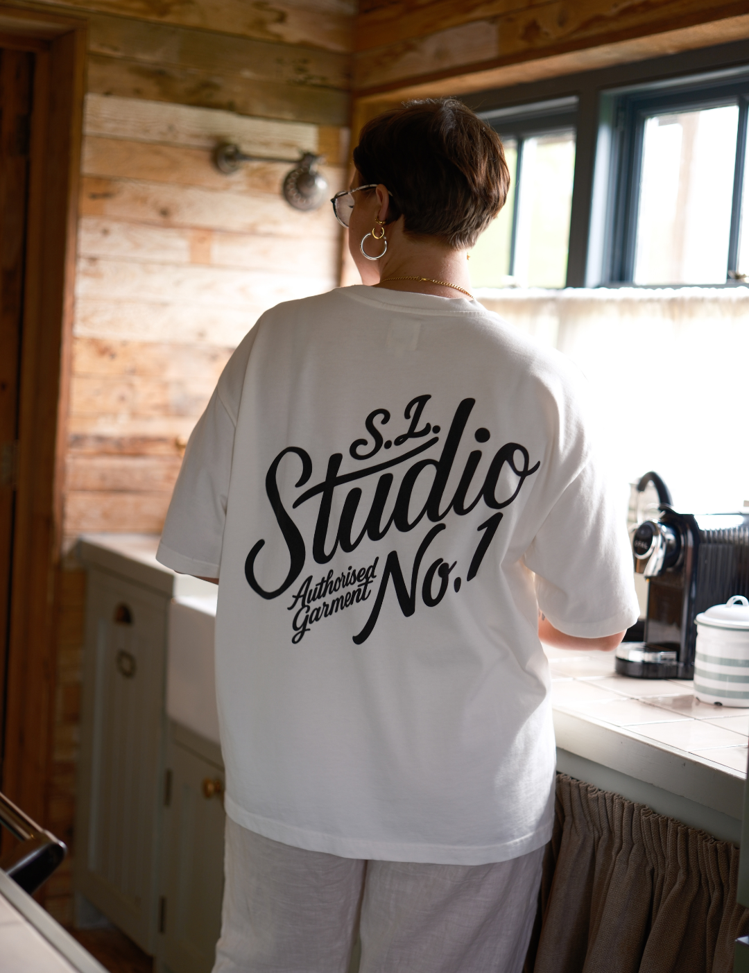 Back view of the White Slow Love Studio oversized boxy t-shirt crafted from premium organic cotton.