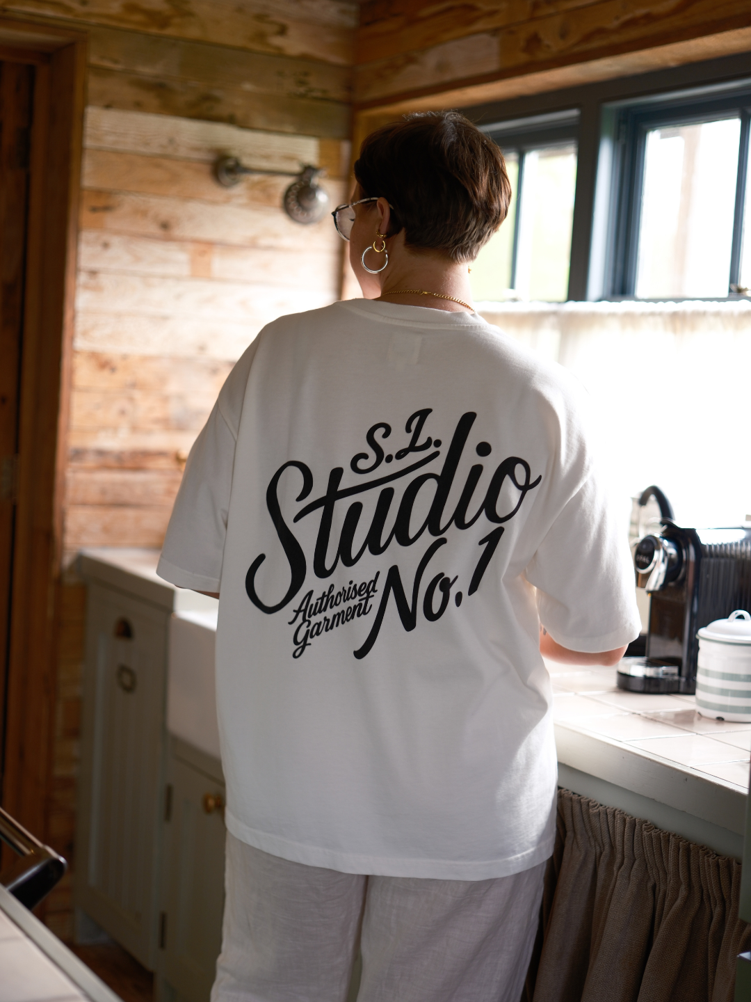 Back view of the White Slow Love Studio oversized boxy t-shirt crafted from premium organic cotton.