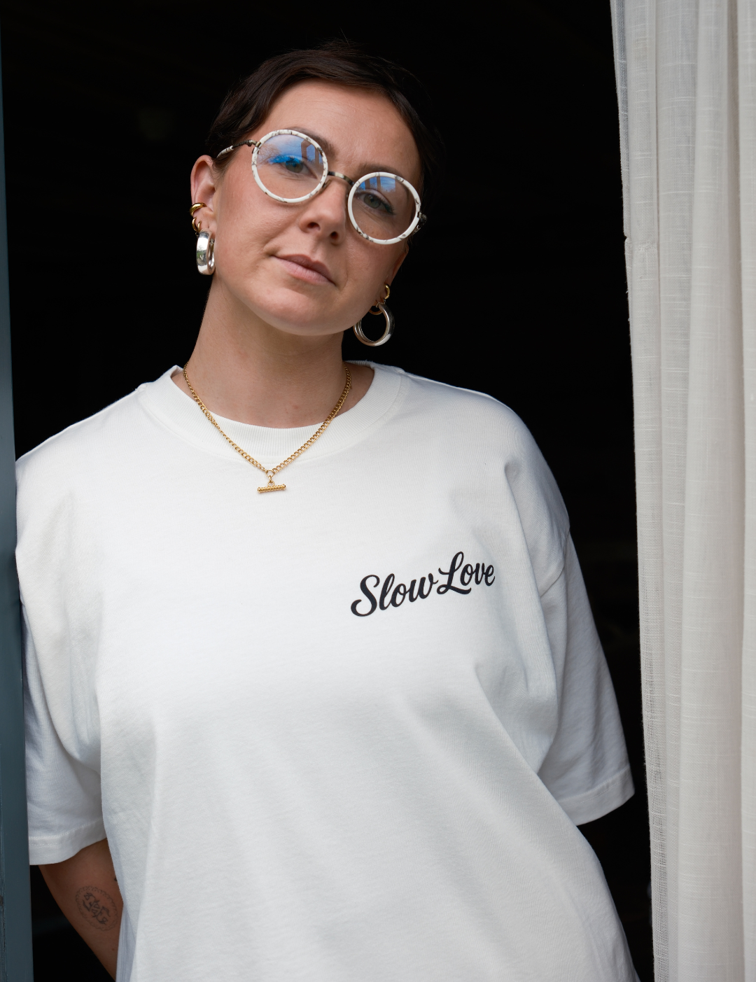 White Slow Love Studio oversized boxy t-shirt by Slow Love Knitwear made from heavyweight 250gsm organic cotton, front view.