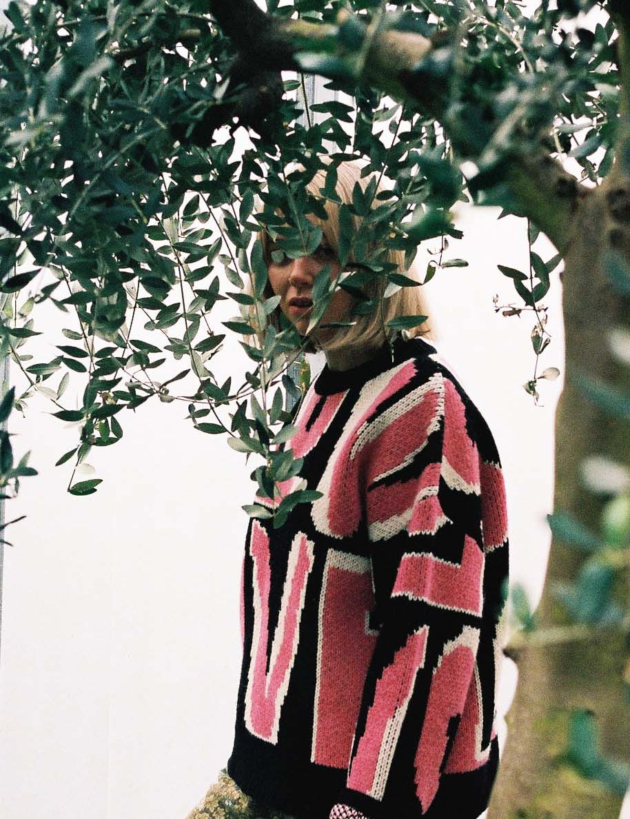 Slow Love Wild Love jumper in pink, knitted from 100% wool with a warm, textured jacquard finish.